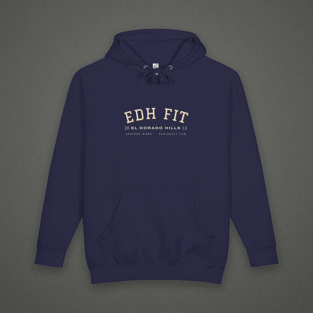 EDHFIT Varsity Arch Heavyweight Hoodie – Navy – Styled flat lay · front · concrete background